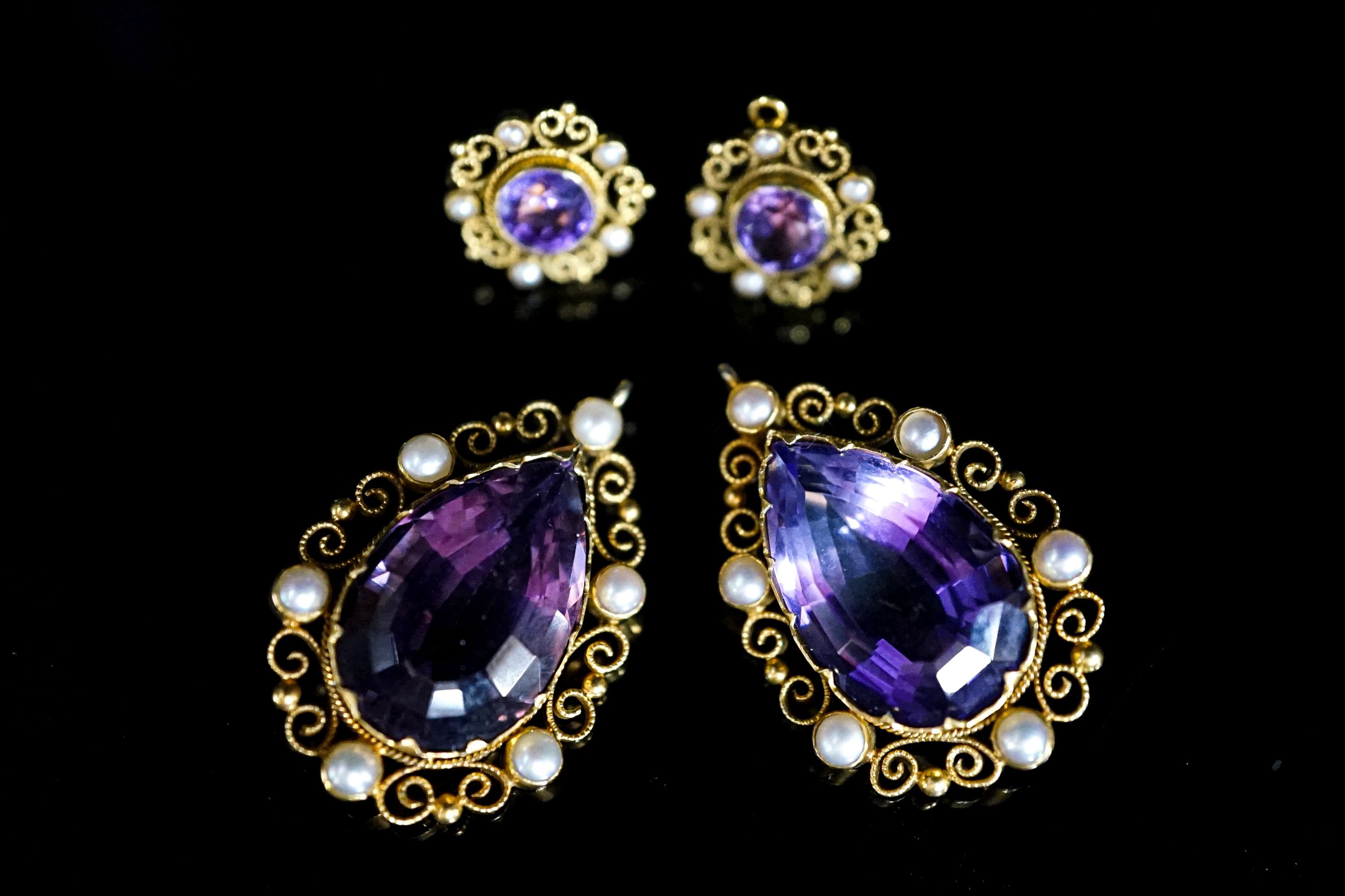 A pair of yellow metal and split pearl mounted pear cut amethyst pendants, 35mm and a pair of similar ear studs, gross weight 23.9 grams.